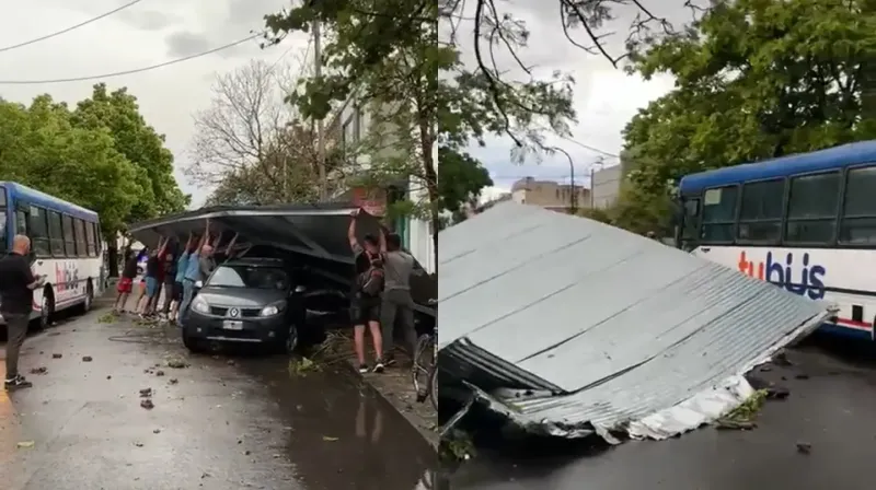 Los vecinos ayudaron a una persona que había quedado atrapada abajo de un cartel. (Foto: captura de video).